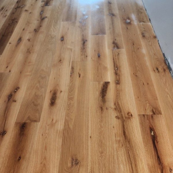 Close view of character-grade white oak boards with knots and mineral streaks